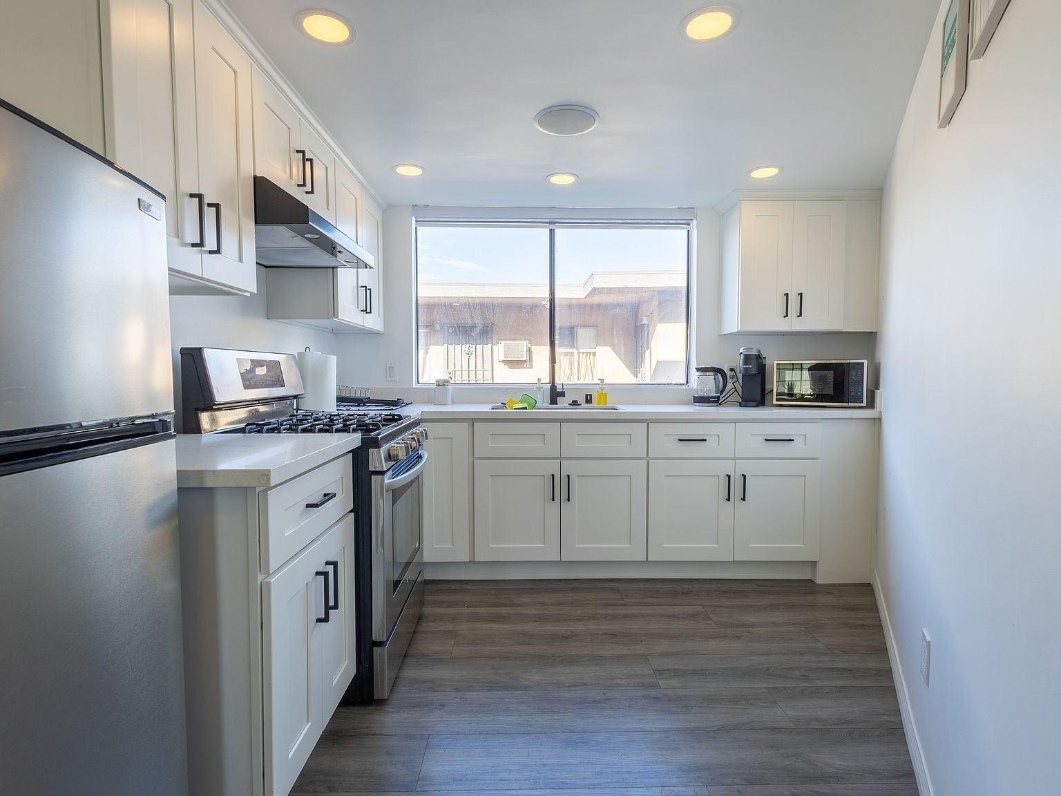 Galley kitchen in Apartment A looking toward the window